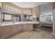 Bathroom featuring double sinks, a shower and jacuzzi tub, and ample counter space at 41 Voltaire Ave, Henderson, NV 89002