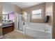 Bathroom view showcasing a shower and a standalone soaking tub at 41 Voltaire Ave, Henderson, NV 89002