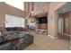 Comfortable living room featuring a fireplace, large windows, and a neutral color palette at 41 Voltaire Ave, Henderson, NV 89002