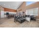 Living room featuring a fireplace, large windows, and a view of the kitchen at 41 Voltaire Ave, Henderson, NV 89002