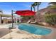 Lovely backyard pool and spa with a gazebo and covered seating area at 41 Voltaire Ave, Henderson, NV 89002