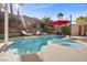 Beautiful pool with a built in spa, tanning chairs and a relaxing patio area at 41 Voltaire Ave, Henderson, NV 89002