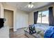 Bedroom with gray bed, wood flooring, and double door closet at 451 Wright Way, Henderson, NV 89015