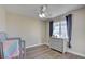 Bedroom with gray dresser, wood flooring, and ceiling fan at 451 Wright Way, Henderson, NV 89015