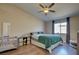 Main bedroom with green bedding and ceiling fan at 451 Wright Way, Henderson, NV 89015