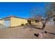 House exterior view with a rock landscaping and a tree at 451 Wright Way, Henderson, NV 89015