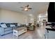 Living room with wood-look floors and open concept to kitchen at 451 Wright Way, Henderson, NV 89015