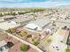 Aerial view of a backyard featuring gravel landscaping, mature trees and privacy fence at 4641 Sommerset Ct, Pahrump, NV 89061