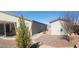 Landscaped backyard with a shed, pathway, and desert plants at 4641 Sommerset Ct, Pahrump, NV 89061