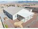 Aerial view of a home's backyard highlighting a covered patio and easy-care landscaping at 4641 Sommerset Ct, Pahrump, NV 89061