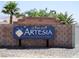 Artesia at Hafen Ranch community sign featuring desert landscaping and a brick wall at 4641 Sommerset Ct, Pahrump, NV 89061