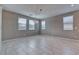 Bright dining room with tile flooring, a modern chandelier, and large windows overlooking the backyard at 4641 Sommerset Ct, Pahrump, NV 89061