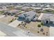 An aerial view showing a home with a three car garage and desert landscaping at 4641 Sommerset Ct, Pahrump, NV 89061