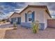 Close up of single-story home with desert landscaping at 4641 Sommerset Ct, Pahrump, NV 89061