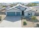 Charming single-story home showcasing a three-car garage and desert landscaping at 4641 Sommerset Ct, Pahrump, NV 89061