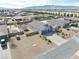 Aerial view of a home showing the three car garage, desert landscaping and surrounding neighborhood at 4641 Sommerset Ct, Pahrump, NV 89061