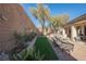 Landscaped backyard with artificial turf, patio furniture, and hot tub at 493 Lace Haven Ct, Henderson, NV 89012