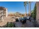 Backyard with fire pit, patio furniture, and artificial turf at 493 Lace Haven Ct, Henderson, NV 89012