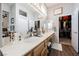 Elegant bathroom with double sinks, large mirror, and walk-in closet at 493 Lace Haven Ct, Henderson, NV 89012