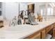 Double vanity bathroom sink with wood cabinets and chrome fixtures at 493 Lace Haven Ct, Henderson, NV 89012