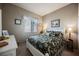 Bedroom with a floral comforter and white wooden bed frame at 493 Lace Haven Ct, Henderson, NV 89012