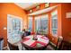 Bright breakfast nook with an orange wall and backyard access at 493 Lace Haven Ct, Henderson, NV 89012