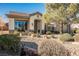 Single-story home with landscaped yard and two-car garage at 493 Lace Haven Ct, Henderson, NV 89012