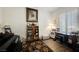 Charming home office features built-in shelving, a writing desk, and a comfortable reading area at 493 Lace Haven Ct, Henderson, NV 89012