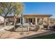 Spacious backyard with a hot tub and covered patio area at 493 Lace Haven Ct, Henderson, NV 89012