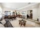 Open concept living and dining area with a neutral color palette and elegant decor at 493 Lace Haven Ct, Henderson, NV 89012