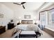 Large main bedroom featuring a king-size bed and ceiling fan at 493 Lace Haven Ct, Henderson, NV 89012