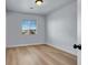 Bright bedroom with large window and hardwood floors at 5089 Sagelyn St, Las Vegas, NV 89122