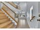 Two-story entryway with wood staircase and tile flooring at 5089 Sagelyn St, Las Vegas, NV 89122