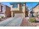 Two-story house with attached garage and desert landscaping at 5089 Sagelyn St, Las Vegas, NV 89122