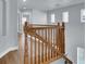 Upstairs hall with wood railing and hardwood floors at 5089 Sagelyn St, Las Vegas, NV 89122