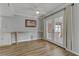 Bright dining area with hardwood floors and French doors leading outside at 513 Chandler St, Henderson, NV 89014