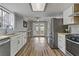 Open kitchen with stainless steel appliances and light wood countertops at 513 Chandler St, Henderson, NV 89014