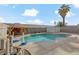 Relaxing kidney-shaped pool with a spacious patio at 513 Chandler St, Henderson, NV 89014