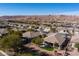 Expansive aerial view of a desert community nestled against a picturesque mountain range at 526 Highland View Ct, Mesquite, NV 89027