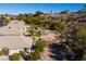 Scenic backyard view with lush landscaping, synthetic grass, and a charming desert setting at 526 Highland View Ct, Mesquite, NV 89027
