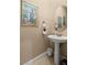 Powder room with pedestal sink and decorative mirror at 526 Highland View Ct, Mesquite, NV 89027