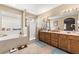 Spa-like bathroom with double sinks, soaking tub, and shower at 526 Highland View Ct, Mesquite, NV 89027