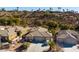 Inviting single-story home with a spacious three-car garage, desert landscaping, and mountain views at 526 Highland View Ct, Mesquite, NV 89027