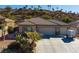 Stunning aerial view of home showcasing a three-car garage and desert landscape at 526 Highland View Ct, Mesquite, NV 89027