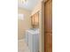 Functional laundry room with washer, dryer, storage cabinets, and natural light at 526 Highland View Ct, Mesquite, NV 89027