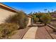 Side yard with walkway, gravel, and desert landscaping at 526 Highland View Ct, Mesquite, NV 89027