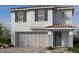 Two-story house with gray siding, attached garage, and dark gray accents at 5742 Remy Rain St, Las Vegas, NV 89148