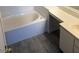 Clean bathroom featuring a bathtub and vanity with modern sink at 5751 E Hacienda Ave # 244, Las Vegas, NV 89122