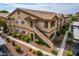 Two-story condo building with landscaping and walkway at 5751 E Hacienda Ave # 244, Las Vegas, NV 89122