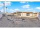 Large backyard with covered patio and gravel at 6205 Hargrove Ave, Las Vegas, NV 89107